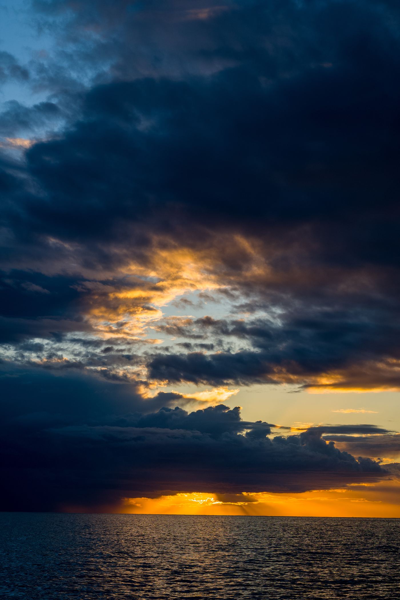 Storm clouds over the sea at sunset